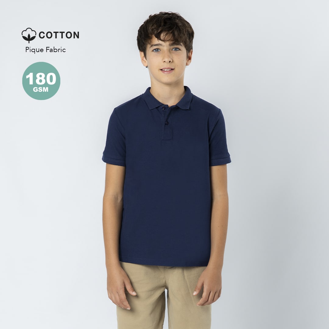 A navy blue children's polo shirt made from cotton pique fabric, featuring a collar and short sleeves. Charles Kids Colour Polo Shirt - Image 1