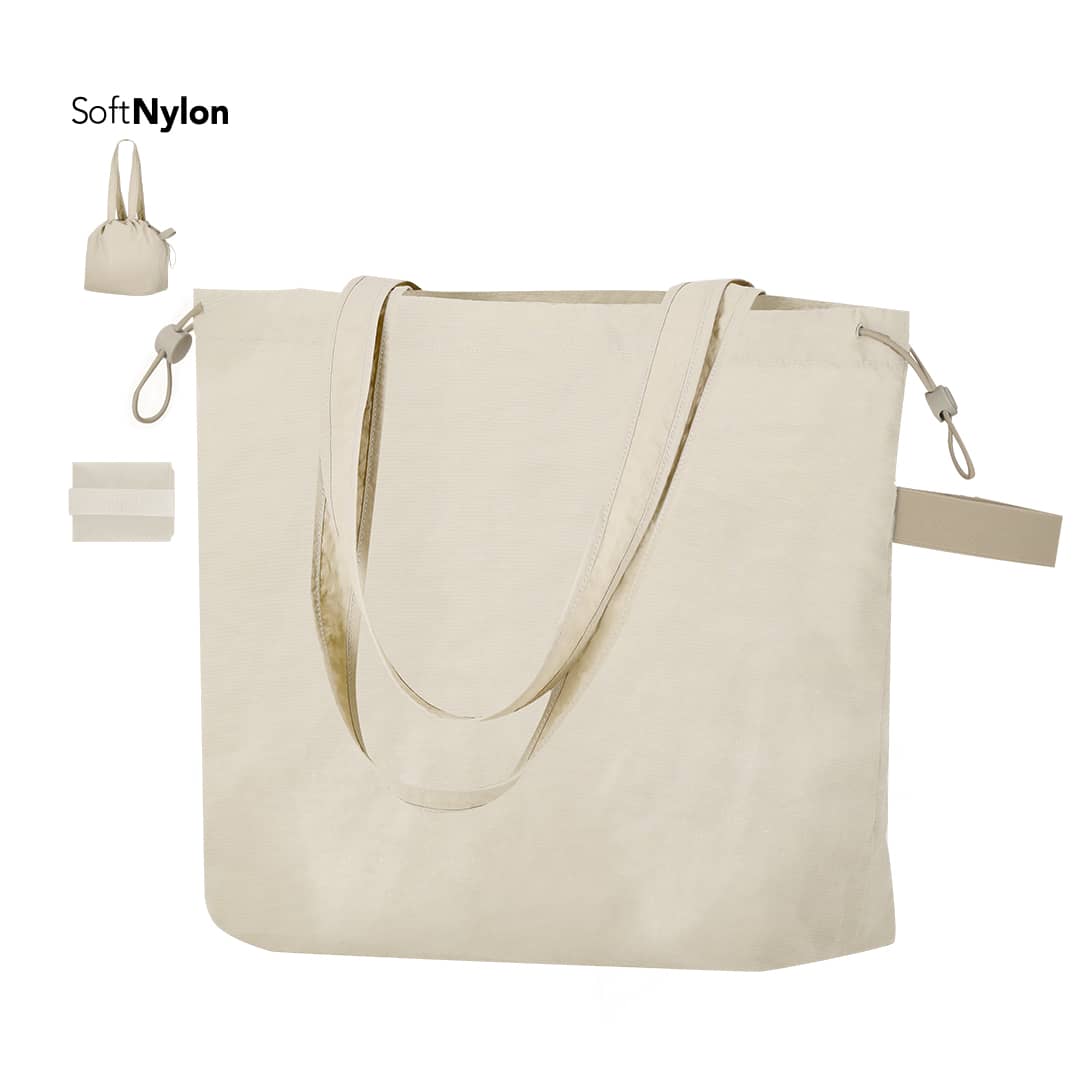 A cream drawstring bag with two handles and a small pouch, made from soft nylon material. It features a logo. Isidhor Bag - Image 1