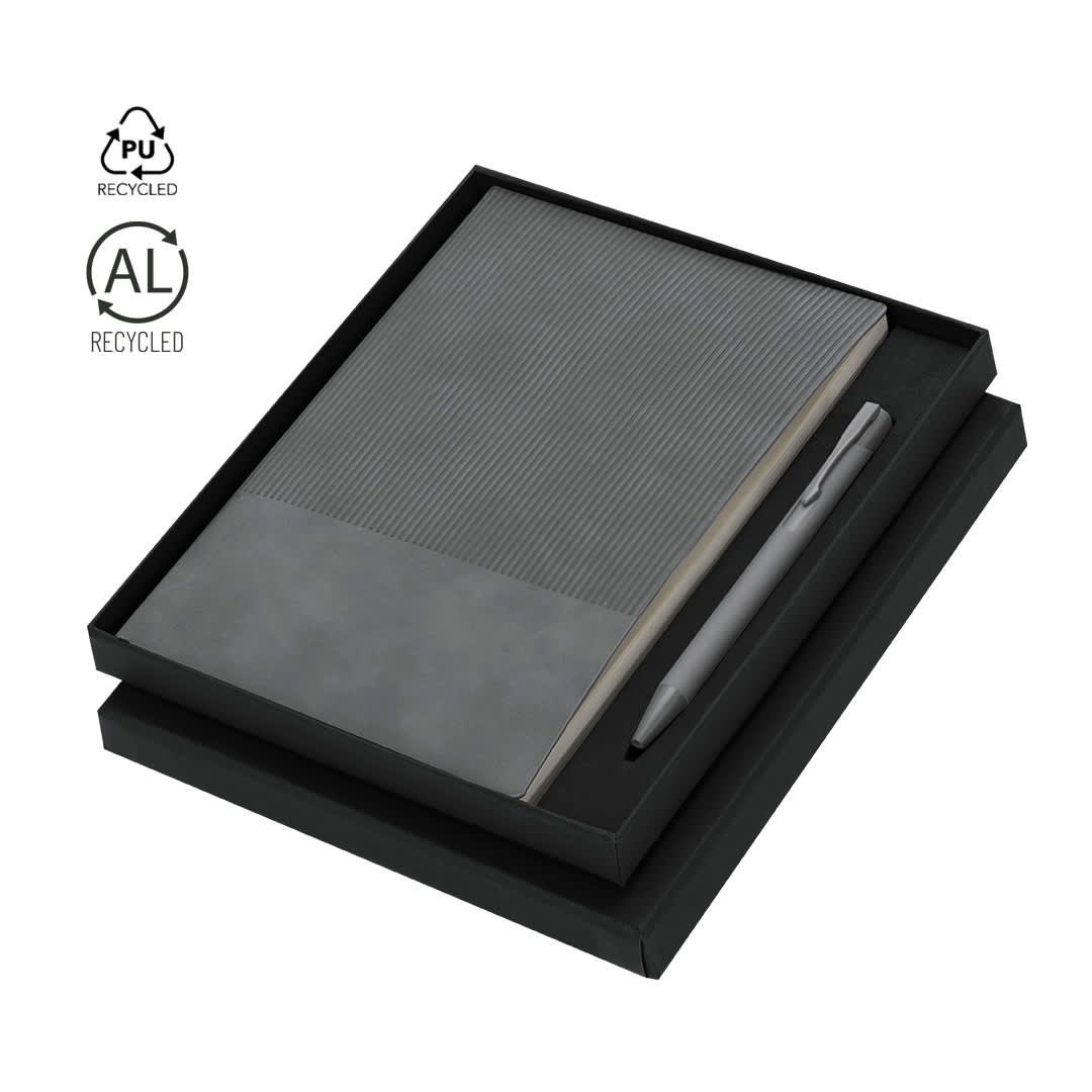 A black boxed set containing a grey ribbed notebook and a pen, with a logo on the box. Holland Set - Image 1
