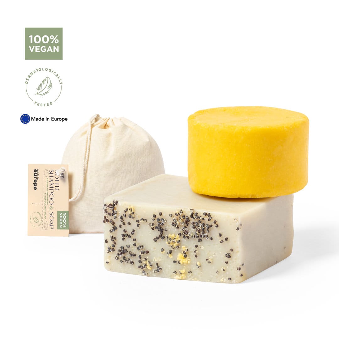 Three vegan soap bars in various colours: a lemon yellow round bar, a white square bar with specks, and a natural fabric pouch. Mionca Set - Image 1