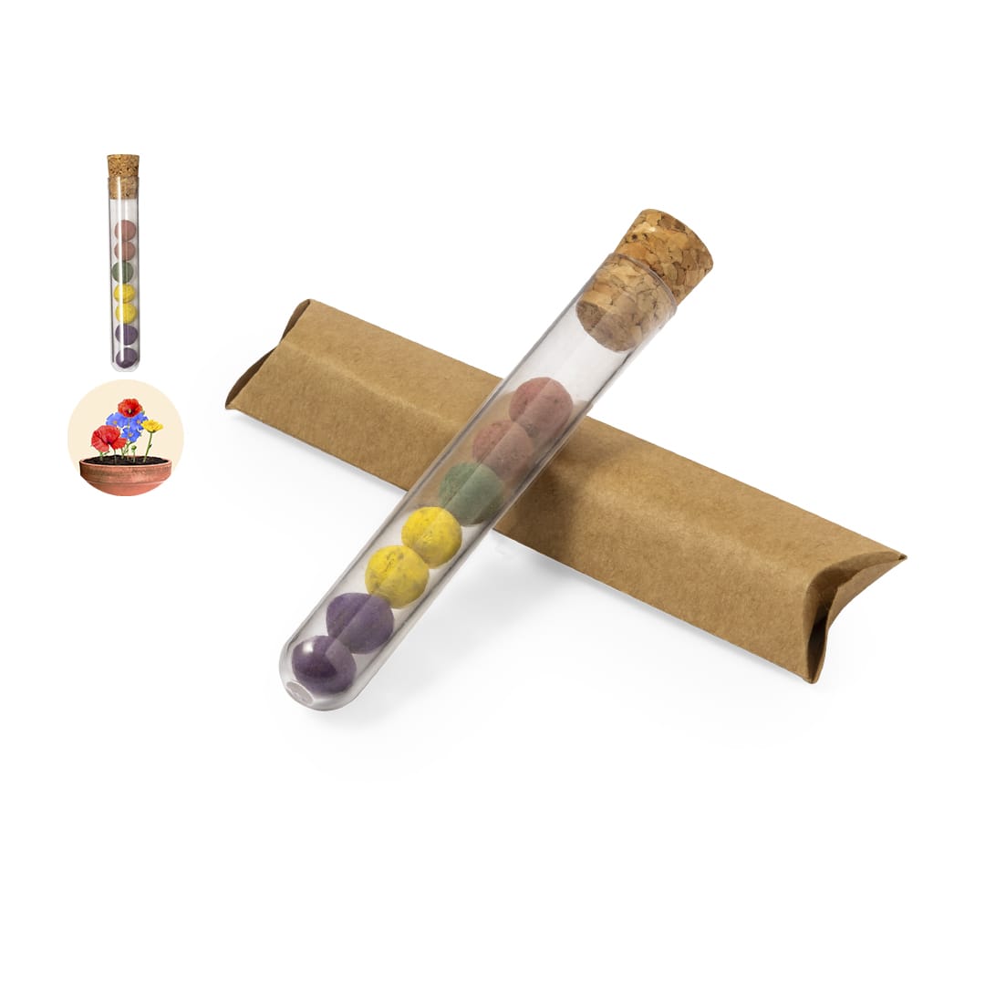 A test tube with a cork stopper contains colourful seed bonbons, resting on a brown cardboard tube. Dinaclex Seed Bonbons Set - Image 1