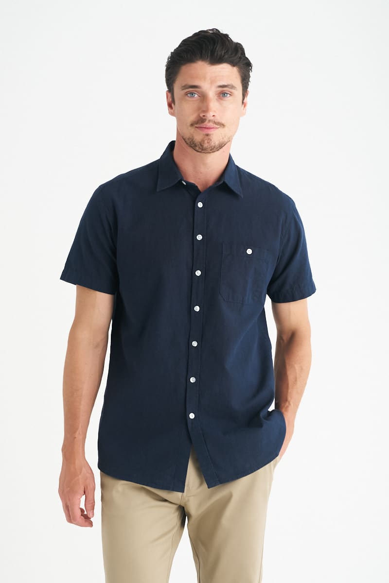 A men's short sleeve shirt in navy blue with a pocket and button-up design. Features a logo on the chest. Floyd - Mens Short Sleeve Shirt - Image 1