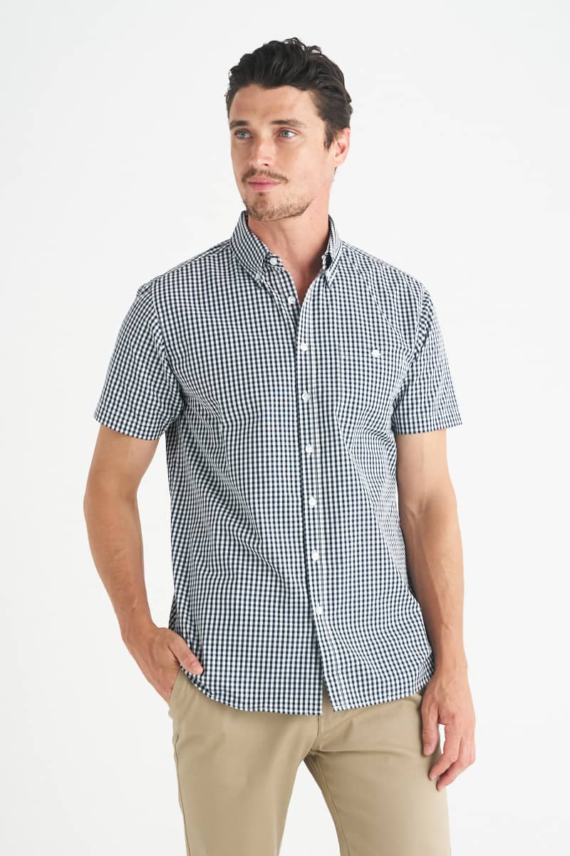 A men's short sleeve button-up shirt featuring a navy and white gingham pattern and a logo. Miller - Mens Short Sleeve Shirt - Image 1