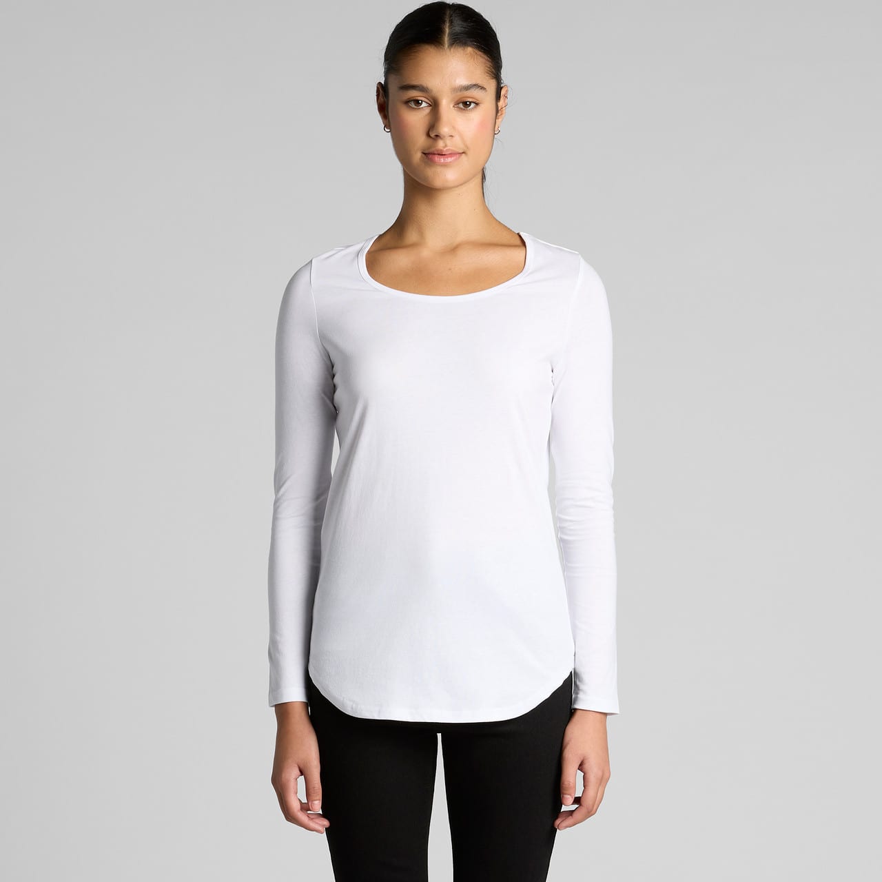 A white long-sleeve T-shirt with a scoop neckline and a rounded hem, featuring a branding logo. Wo's Mali L/S Tee - Image 1