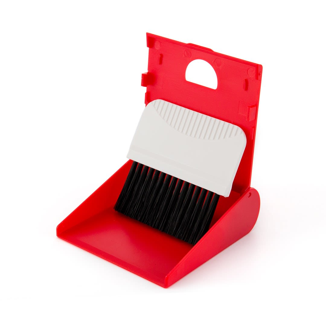 A red cleaning set featuring a small dustpan with a white handle and black bristles for sweeping. Naibel Cleaning Set - Image 1