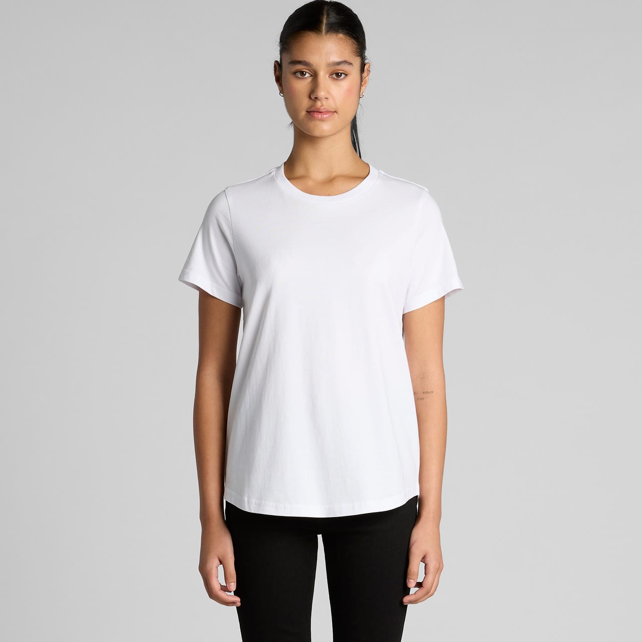 A white t-shirt with a relaxed fit and short sleeves, featuring a subtle logo. Wo's Maple Curve Tee - Image 1