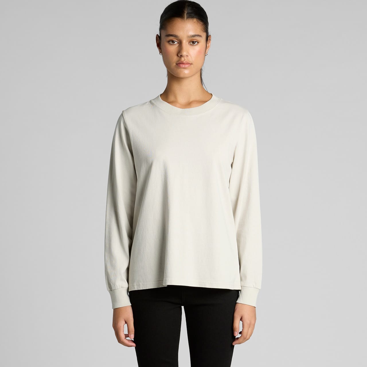 A long-sleeved, faded light grey T-shirt with a relaxed fit. Features long sleeves and a simple design. Wo's Heavy Faded L/S Tee - Image 1