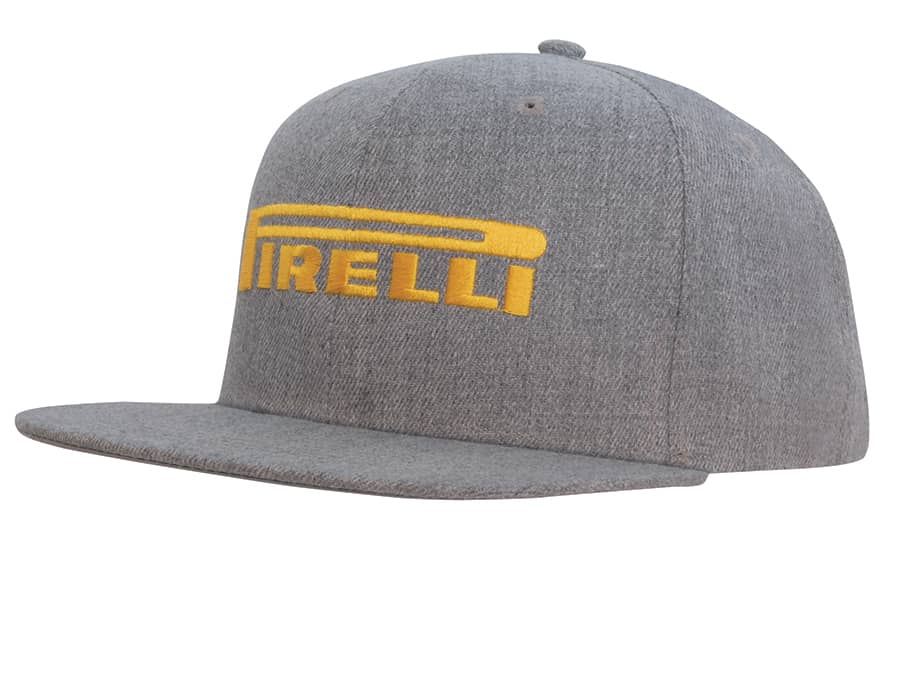 A grey flat peak cap with a yellow logo. The cap features a structured design and a stiff brim. Premium American Twill Flat Peak Cap - Image 1