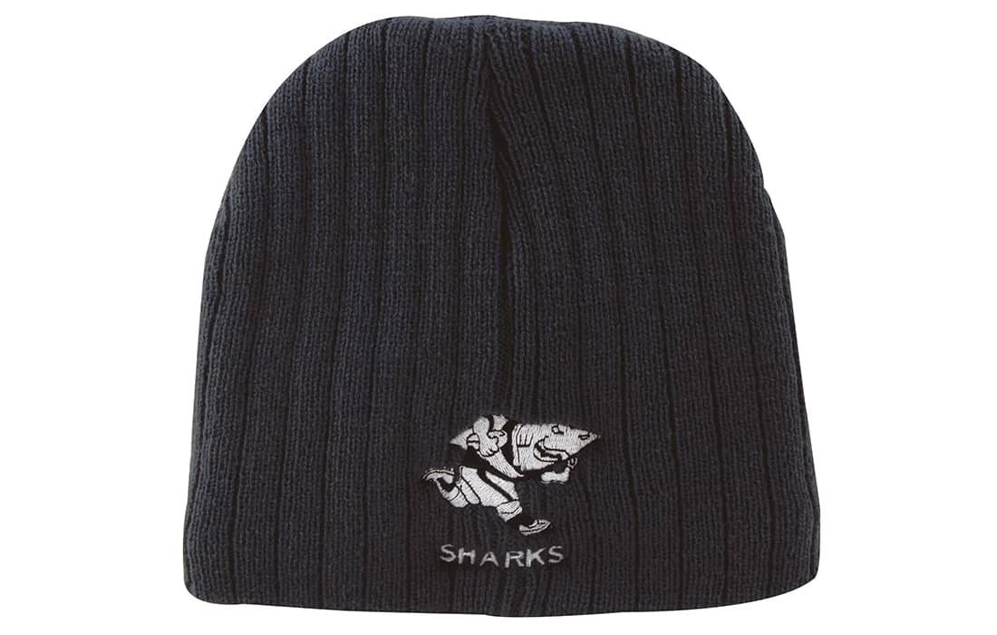 A black cable knit beanie featuring an embroidered logo of a shark character. Cable Knit Beanie - Toque - Image 1