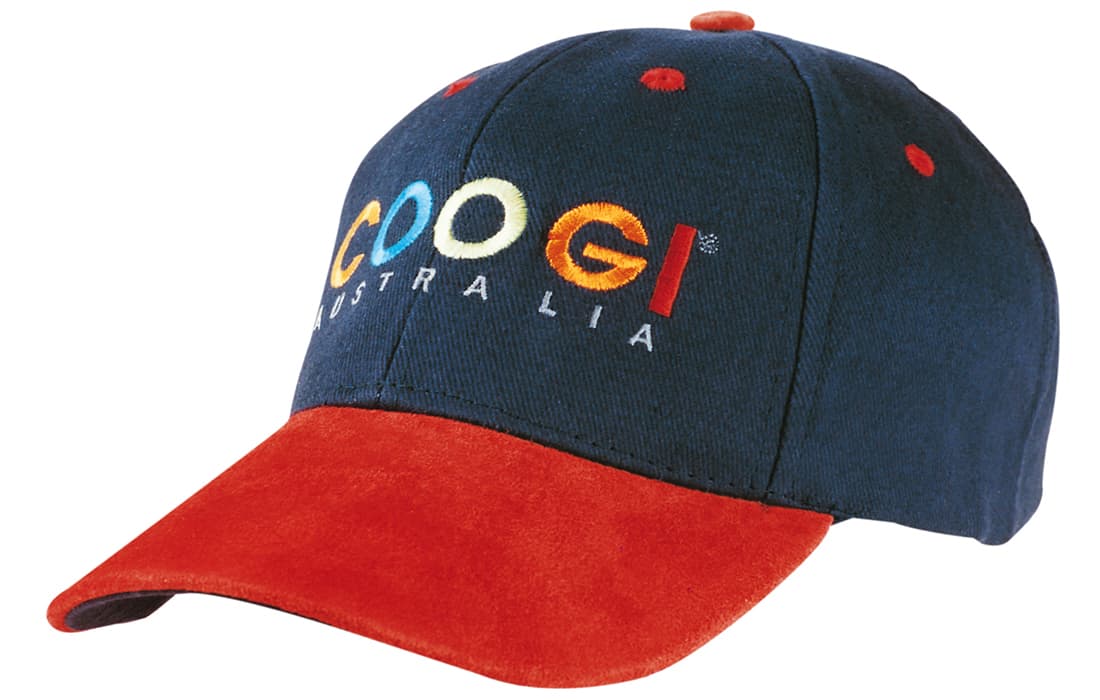 A cap featuring a navy blue crown and a red suede peak, with a logo on the front. Brushed Heavy Cotton with Suede Peak - Image 1