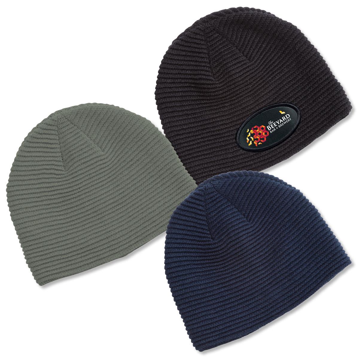 Three Ruga Knit Beanies in dark green, black, and navy, featuring a branded logo on the black beanie. Ruga Knit Beanie - Image 1