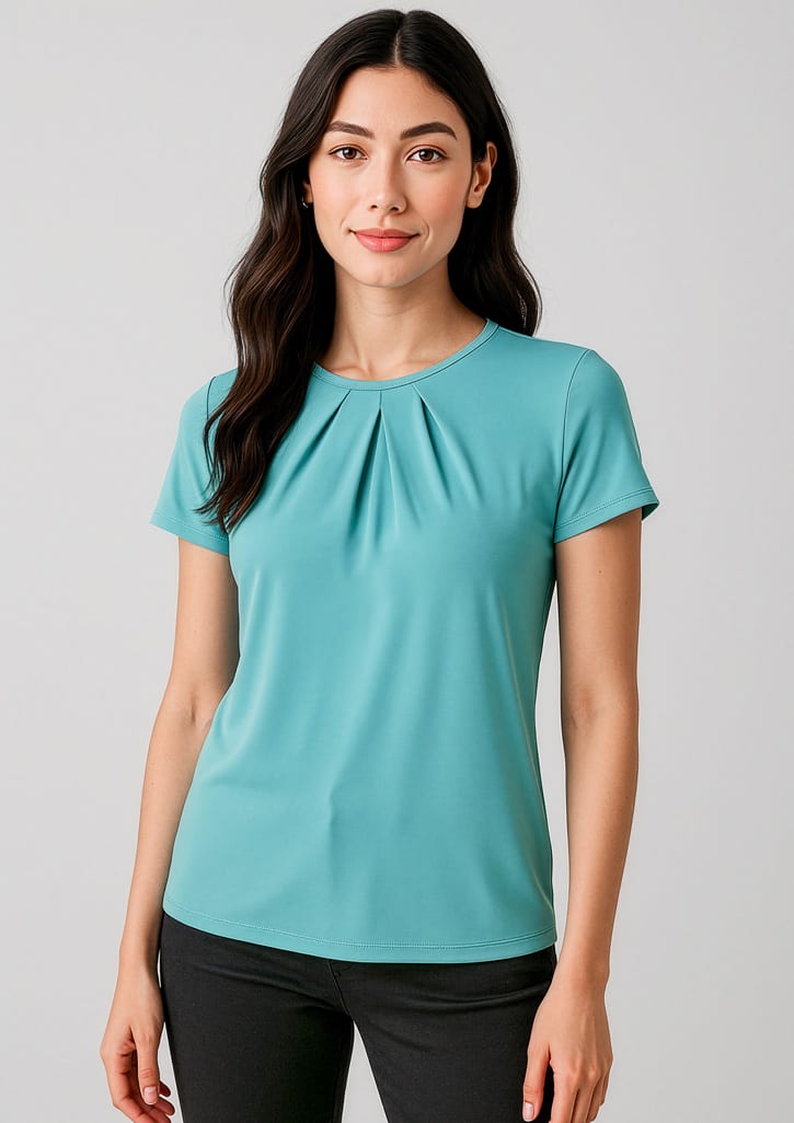 A teal short sleeve top with pleats, featuring a fitted design and a subtle logo. Womens Blaise Short Sleeve Top - Image 1