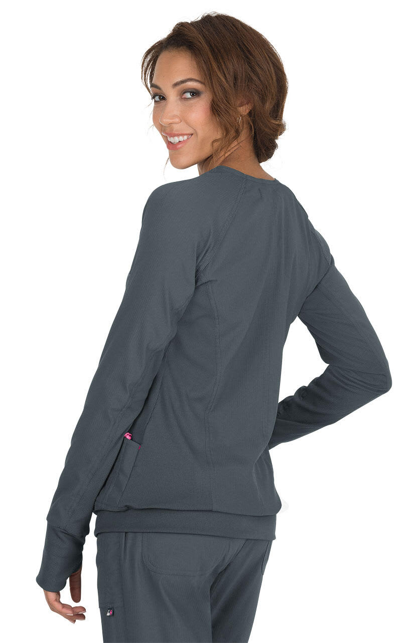A smiling woman in a grey Clarity Jacket, viewed from the back, showcasing its slim fit and stylish design. Clarity Jacket - Image 1