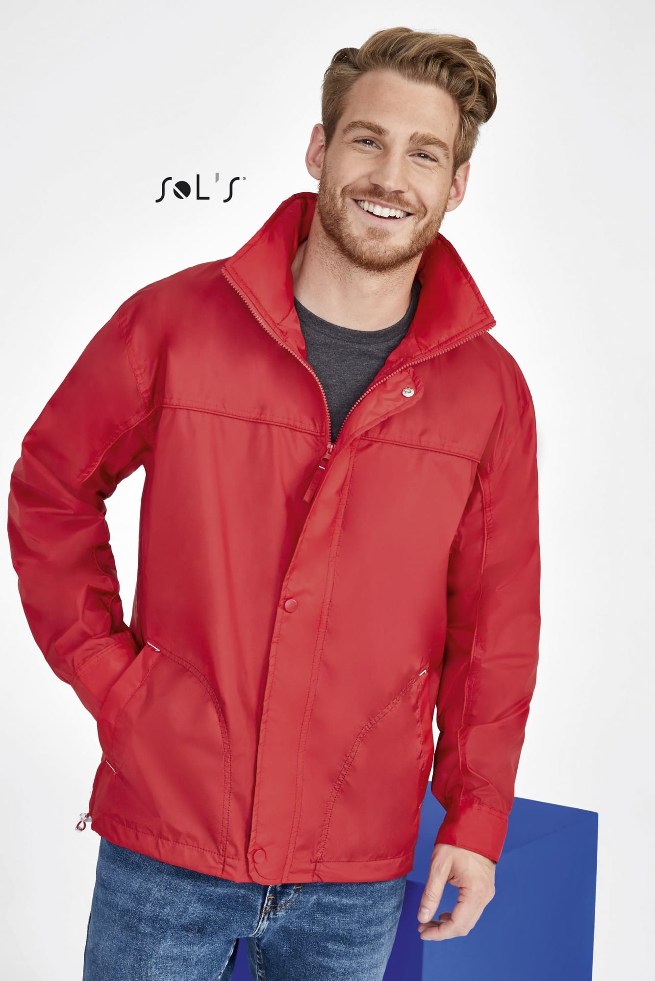 A red men's jacket with a hood, featuring a water-repellent exterior and a jersey lining, and includes a logo. Jacket - Men's Jersy lined , water repellent , hood MISTRAL - Image 1