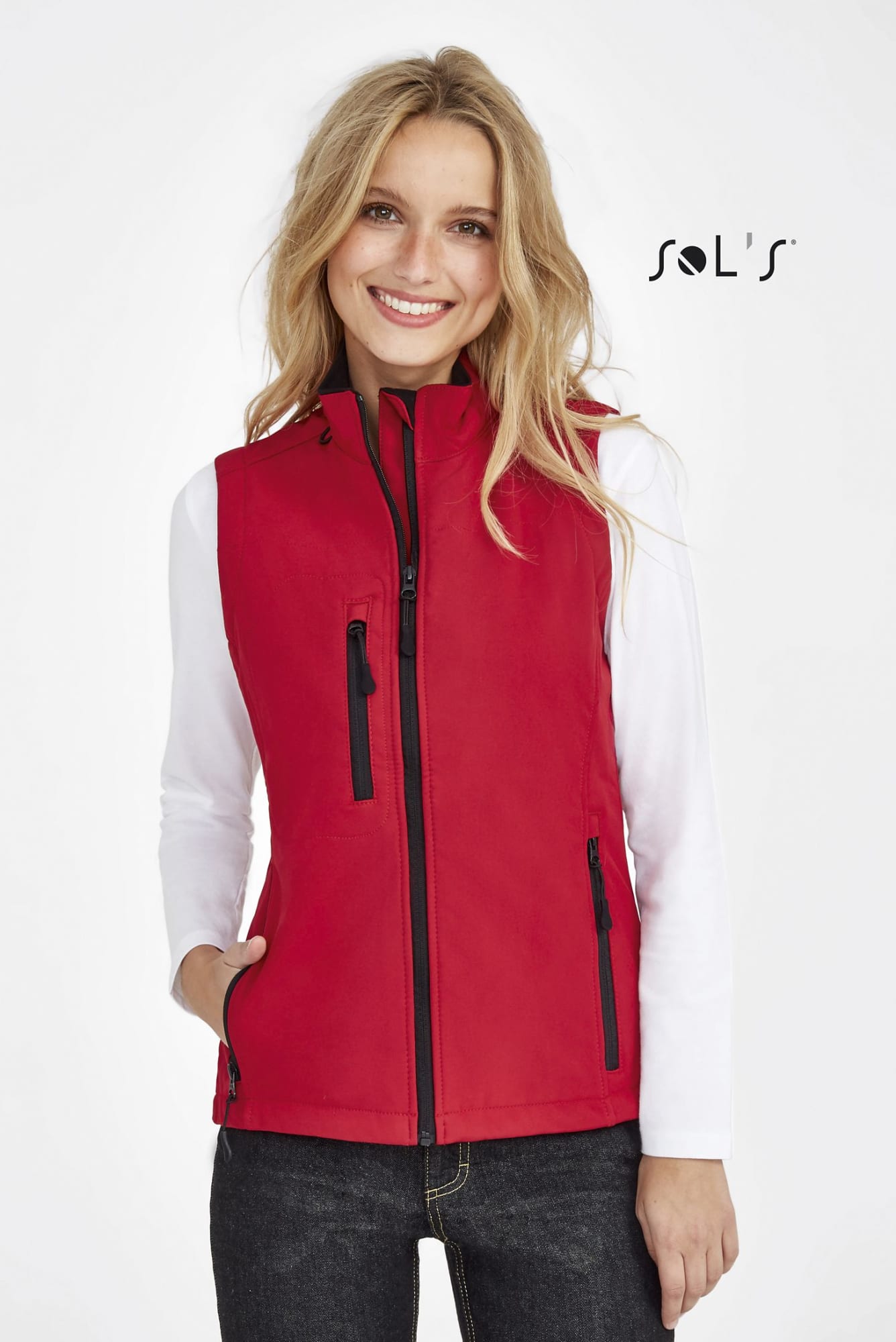A red women's softshell vest featuring zippered pockets and contrasting black zippers, with a logo on the side. Vest women's softshell 8000mm waterproof RALLYE - Image 1