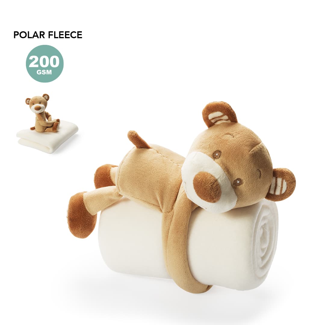 A plush, rolled blanket in cream with a brown teddy bear design, featuring a branded logo. Yogui Blanket - Image 1
