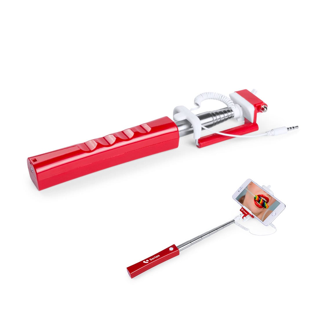A red selfie stick with a retractable arm and a holder for a smartphone, featuring a branding logo. Kroper Selfie Stick - Image 1
