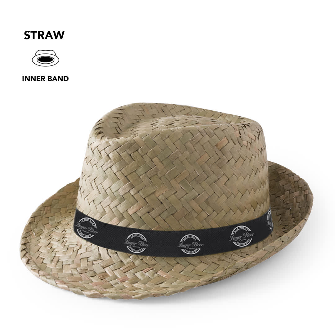 A straw hat with a wide brim and a black inner band featuring a logo. It has a natural, woven texture. Zelio Hat - Image 1