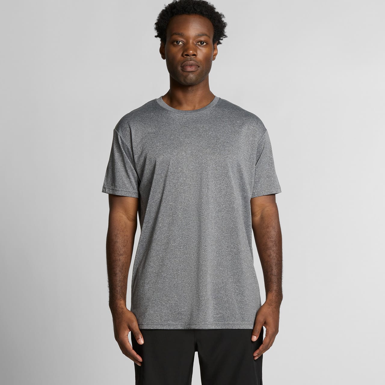 A grey athletic t-shirt with a relaxed fit, featuring a logo on the front. Ideal for active wear. Staple Active Tee - Image 1
