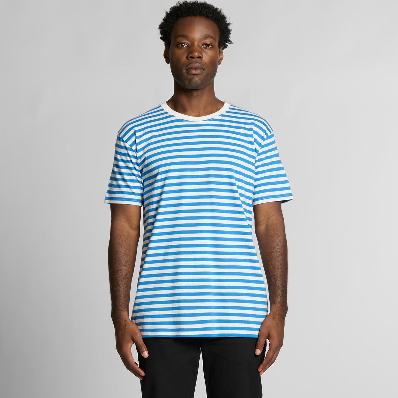 A striped T-shirt featuring blue and white stripes, with a classic crew neckline and a logo on the chest. Staple Stripe Tee - Image 1