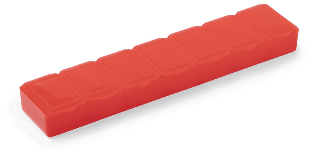 A red Lucam Pillbox featuring multiple compartments for organising pills. It has a sleek, rectangular design and a logo. Lucam Pillbox - Image 1
