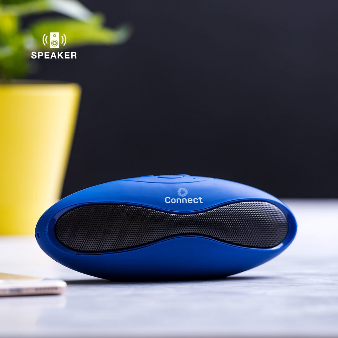 A blue speaker with a curved design, featuring a logo and a textured speaker grille, placed on a countertop. Morals Speaker - Image 1