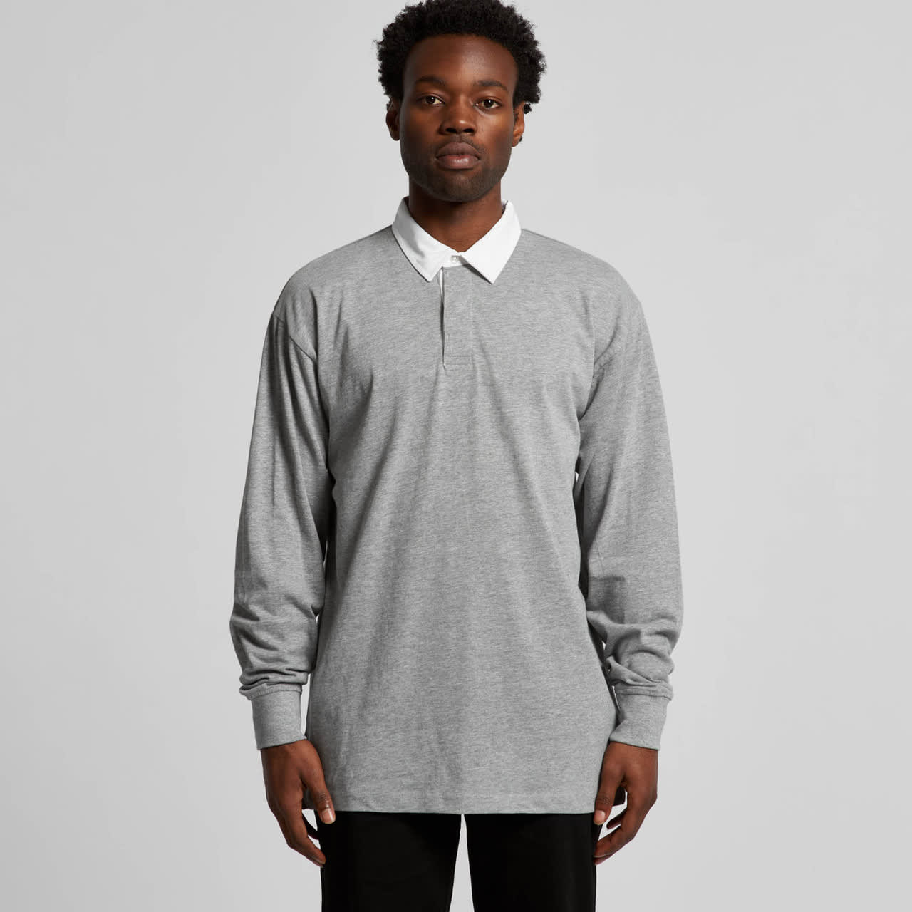 A long-sleeved grey rugby jersey with a white collar and a logo on the chest. Rugby Jersey - Image 1
