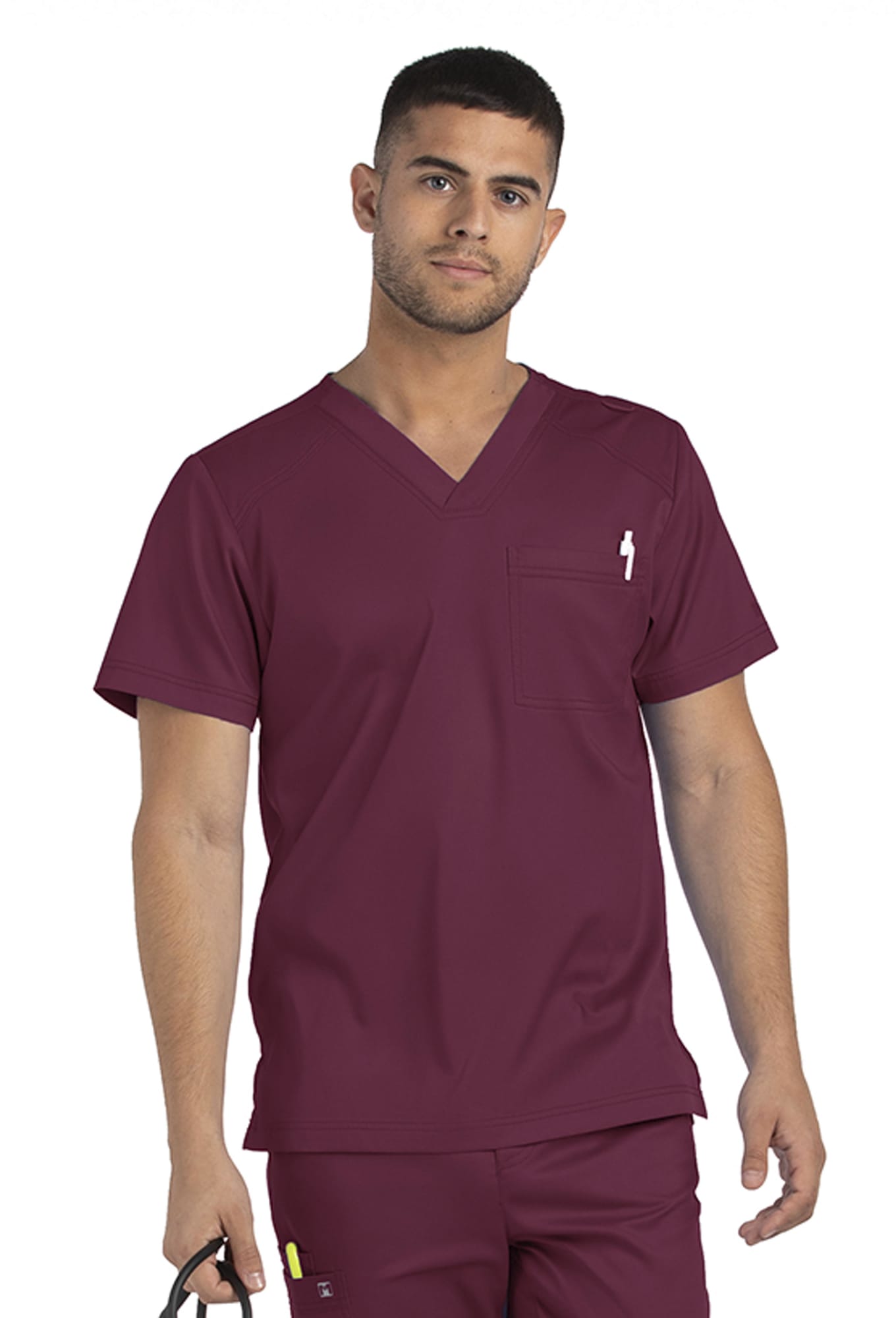 A man wears a maroon men's tuckable V-neck top with a chest pocket and holds a pair of scissors. Matrix Mens Tuckable V-Neck Top - Image 1