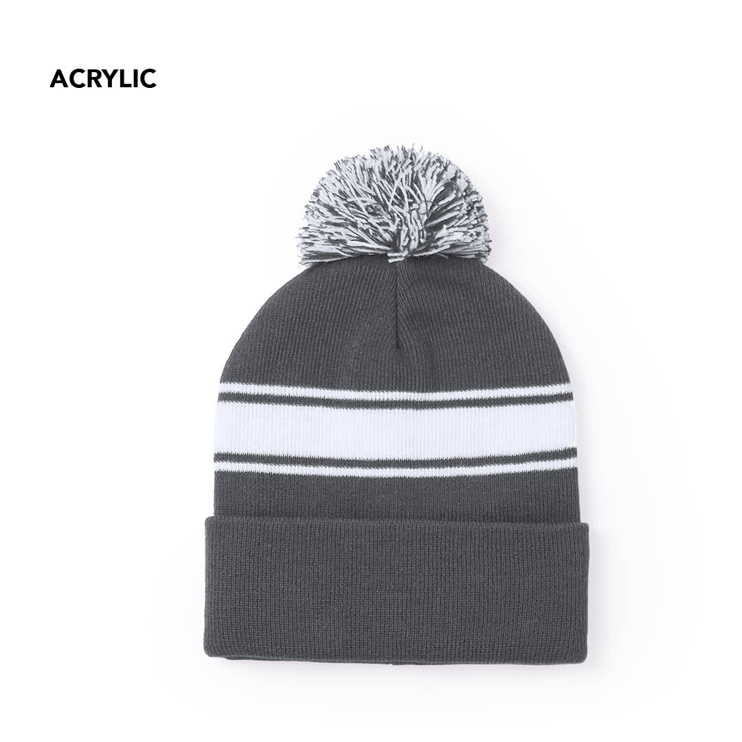 A grey beanie with a white and black striped design and a pom-pom on top. It is made of acrylic and features a logo. Baikof Hat - Image 1