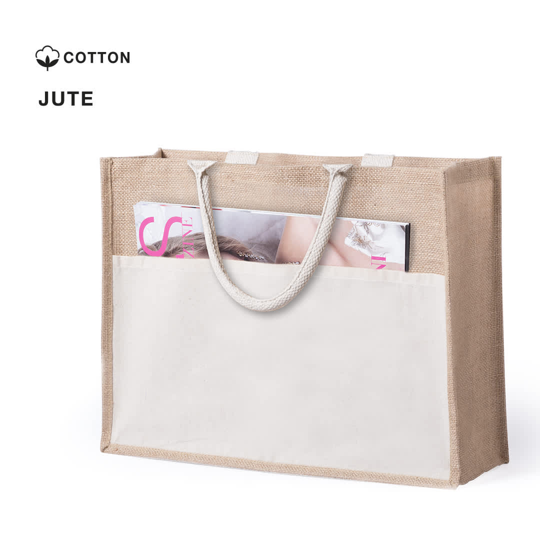 A natural jute tote bag with a cream panel and handles, featuring a magazine partially visible inside. Cekon Bag - Image 1