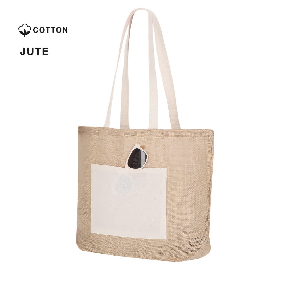 A jute tote bag in natural brown with a cream pocket and shoulder straps. It features a logo on the side. Farus Bag - Image 1