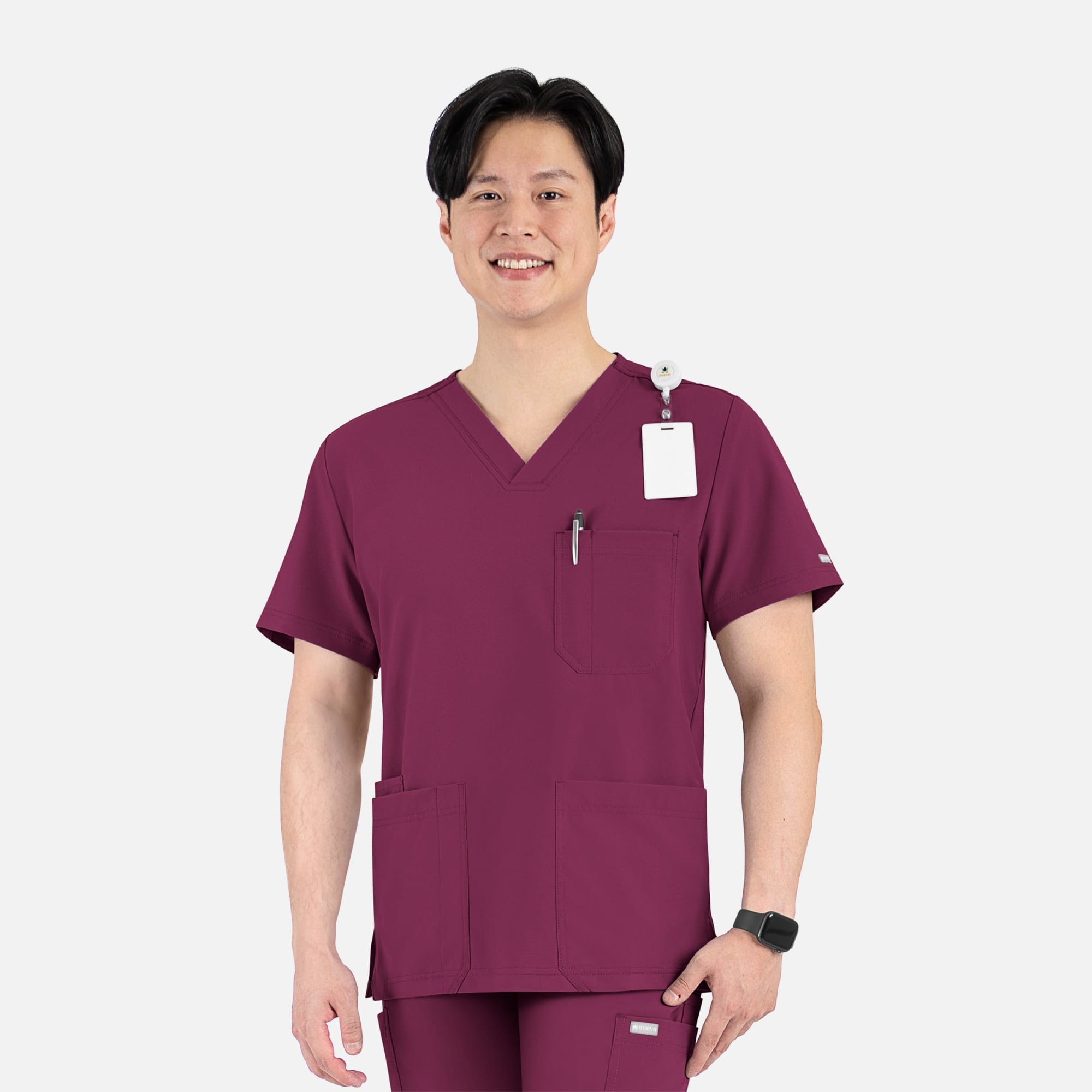 A men's v-neck top in maroon featuring four pockets and a logo, worn by a smiling model. Momentum Mens 4 Pocket V-Neck Top - Image 1
