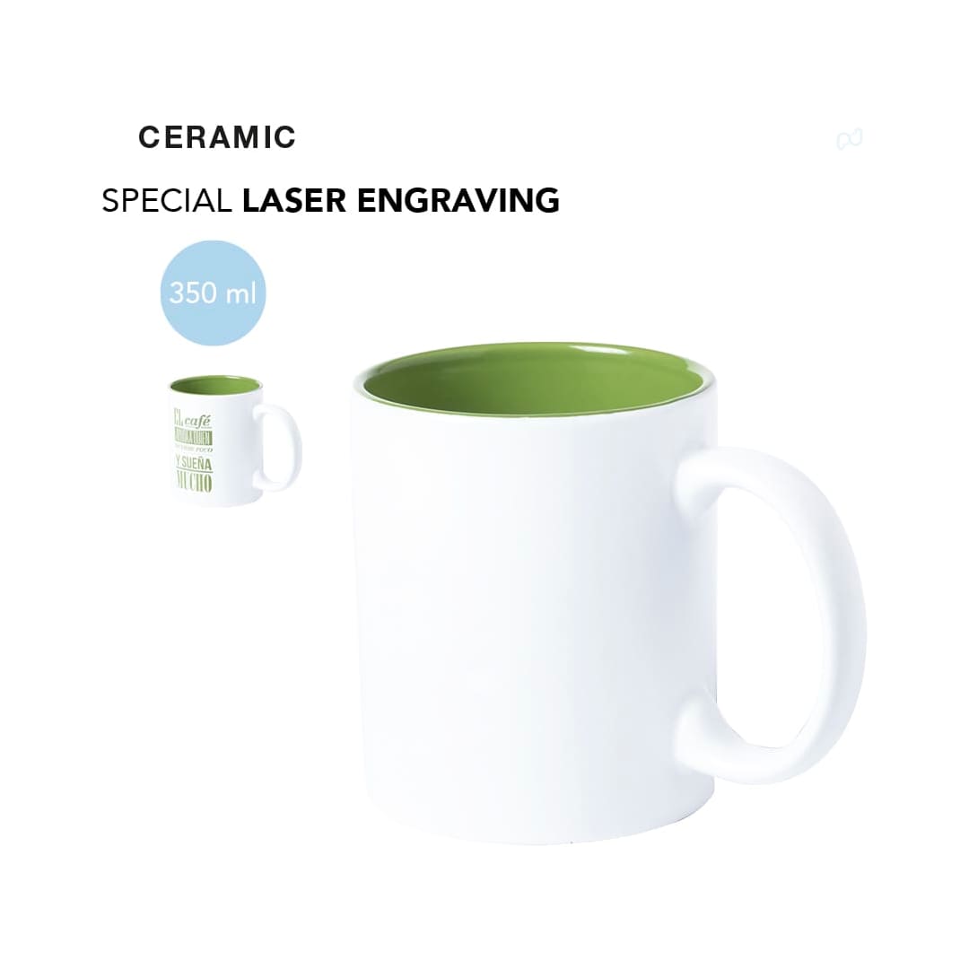 A ceramic coffee mug with a white exterior and a green interior, featuring a handle and a logo. Holds 350 ml. Kulmer Mug - Image 1