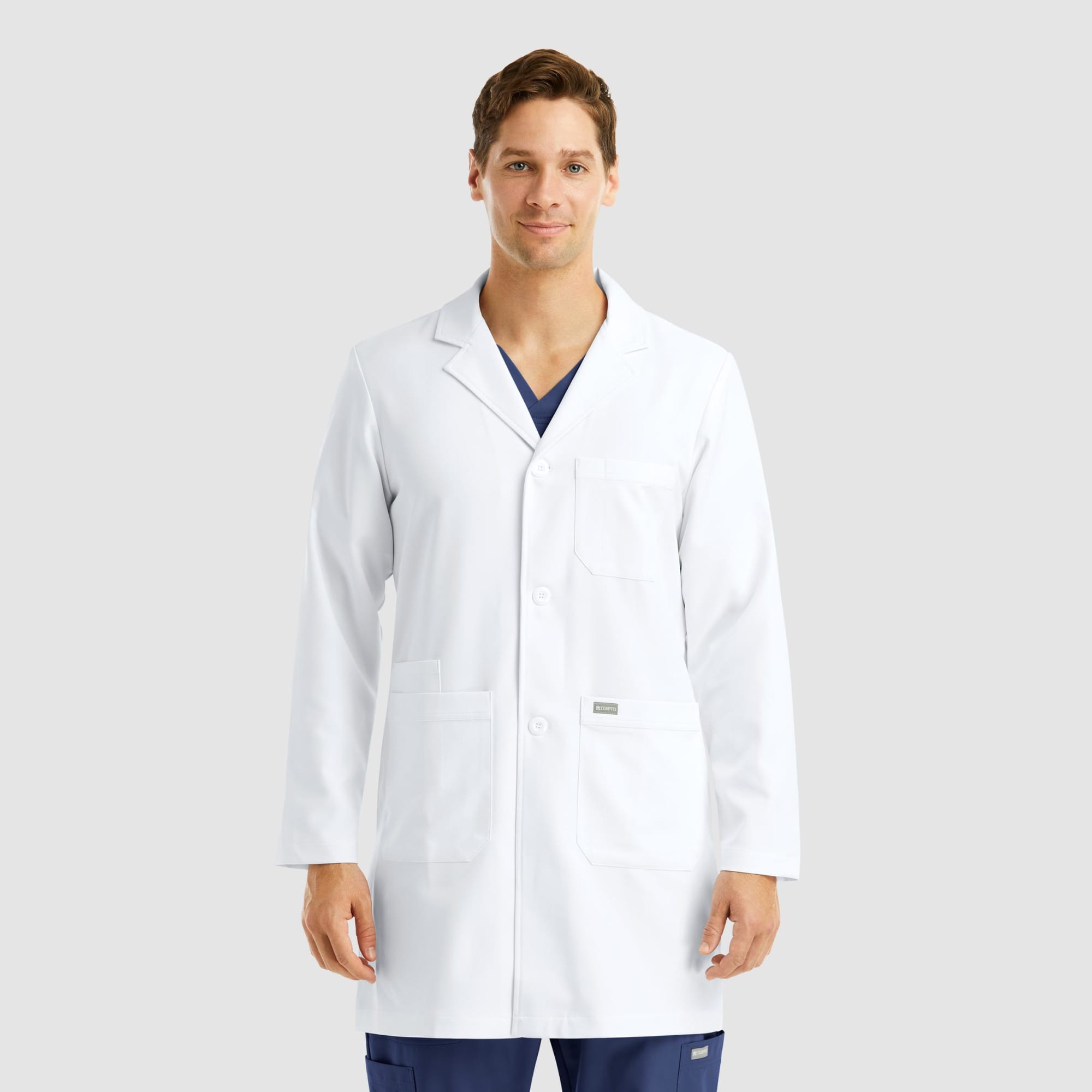A mid-length white lab coat for men, featuring three pockets and a logo. Momentum Mens Mid Length Lab Coat (35.5") - Image 1