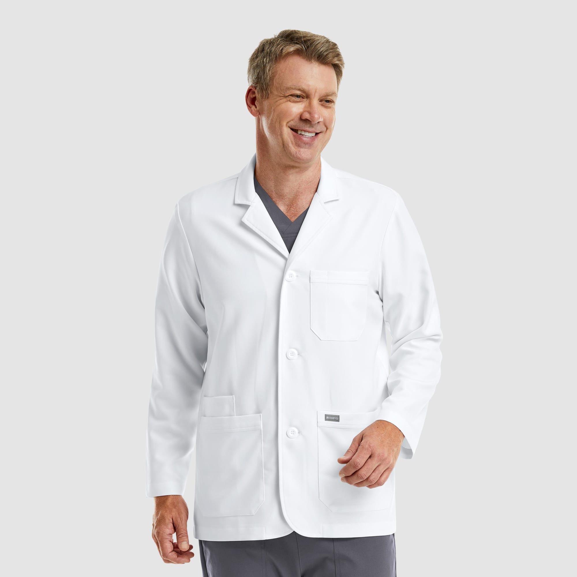 A white men's consultation lab coat with a single chest pocket and two side pockets, worn by a smiling male model. Momentum Mens Consultation Lab Coat (30") - Image 1