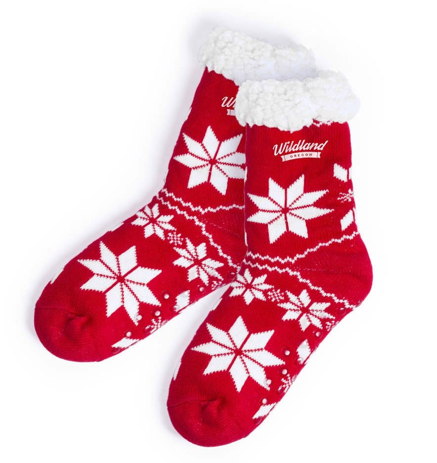 A pair of red socks featuring white snowflake patterns and a fluffy white cuff. The socks have a logo on them. Camiz - Image 1