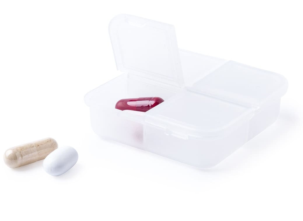 A transparent pill organiser with four compartments, containing three capsules in white, cream, and maroon. Edmor - Image 1