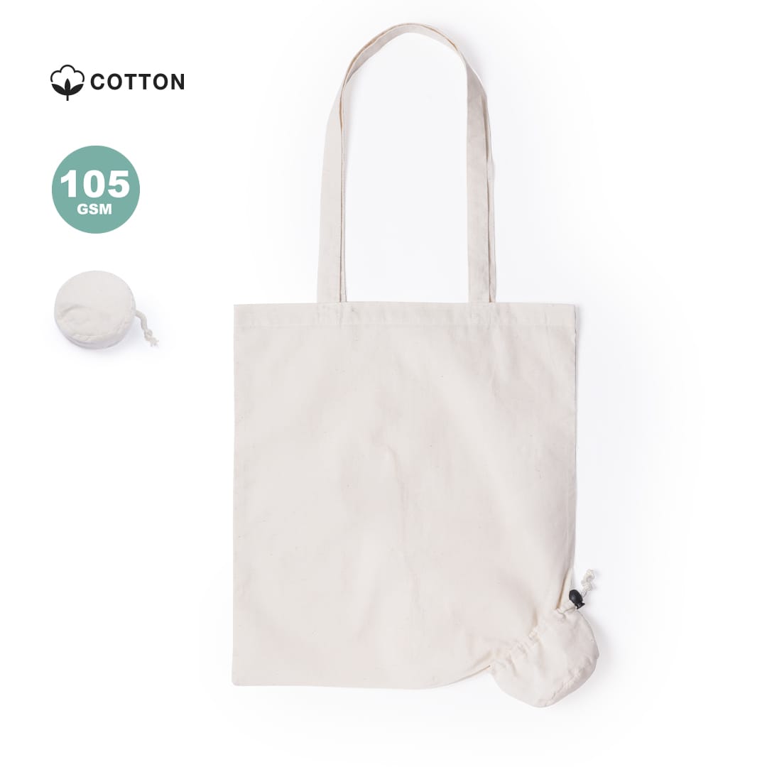 A foldable tote bag in a light beige colour with straps, featuring a compact storage pouch and a logo. Helakel Foldable Bag - Image 1