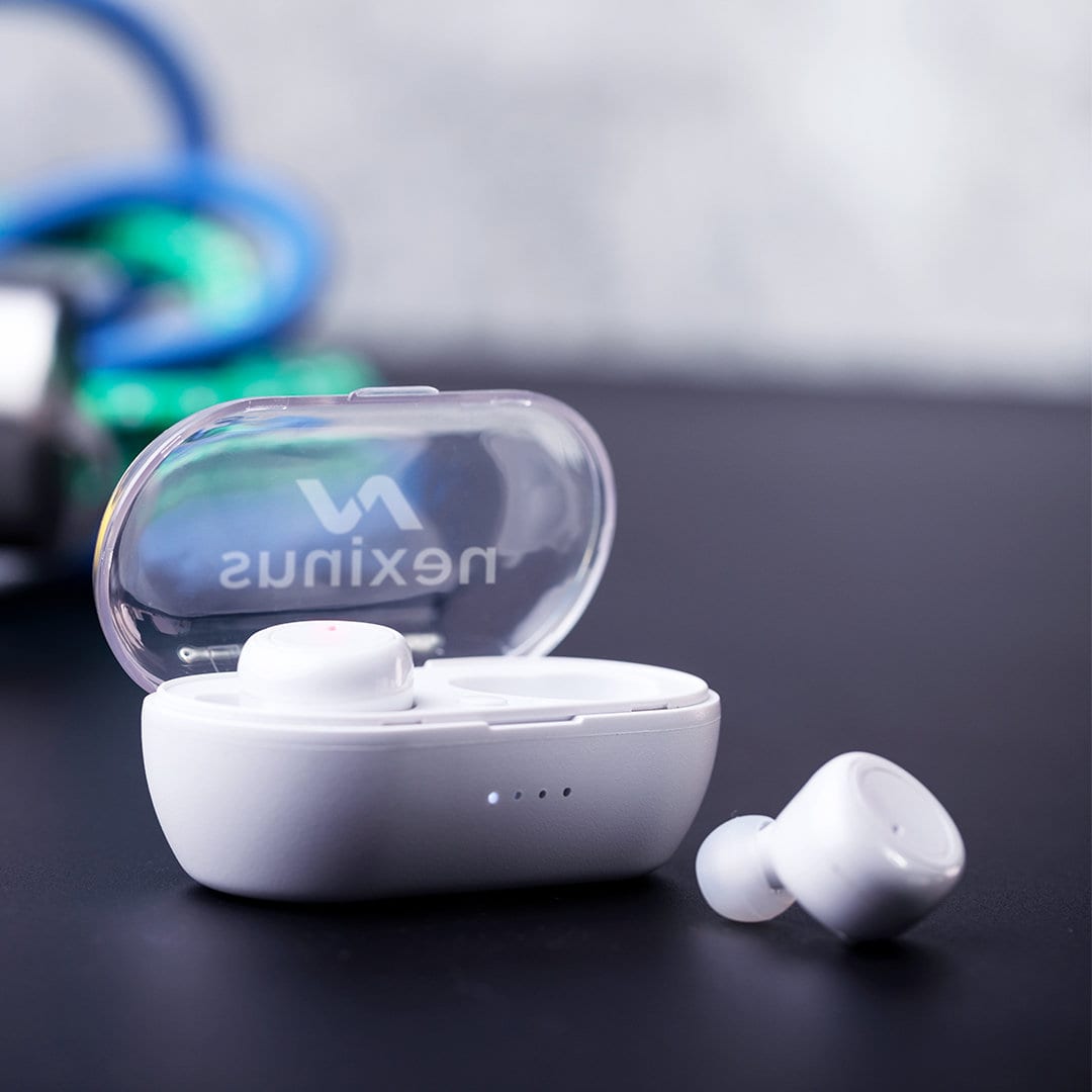White wireless earphones in a charging case, with an additional earbud resting on a dark surface. The case has a logo. Merkus Earphones - Image 1