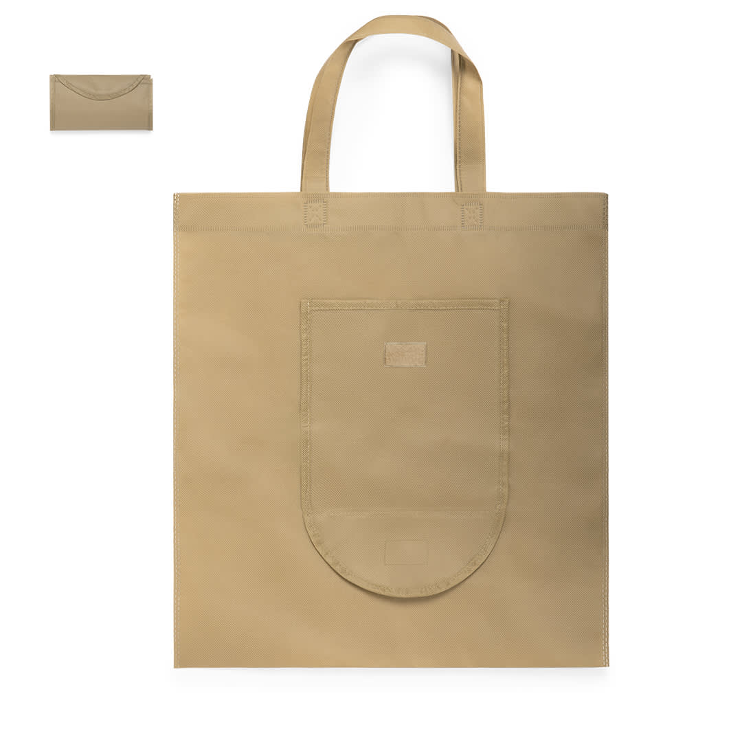 A tan foldable reusable grocery bag with a front pocket and dual handles. Includes a compact version in the corner. Fesor Foldable Bag - Image 1