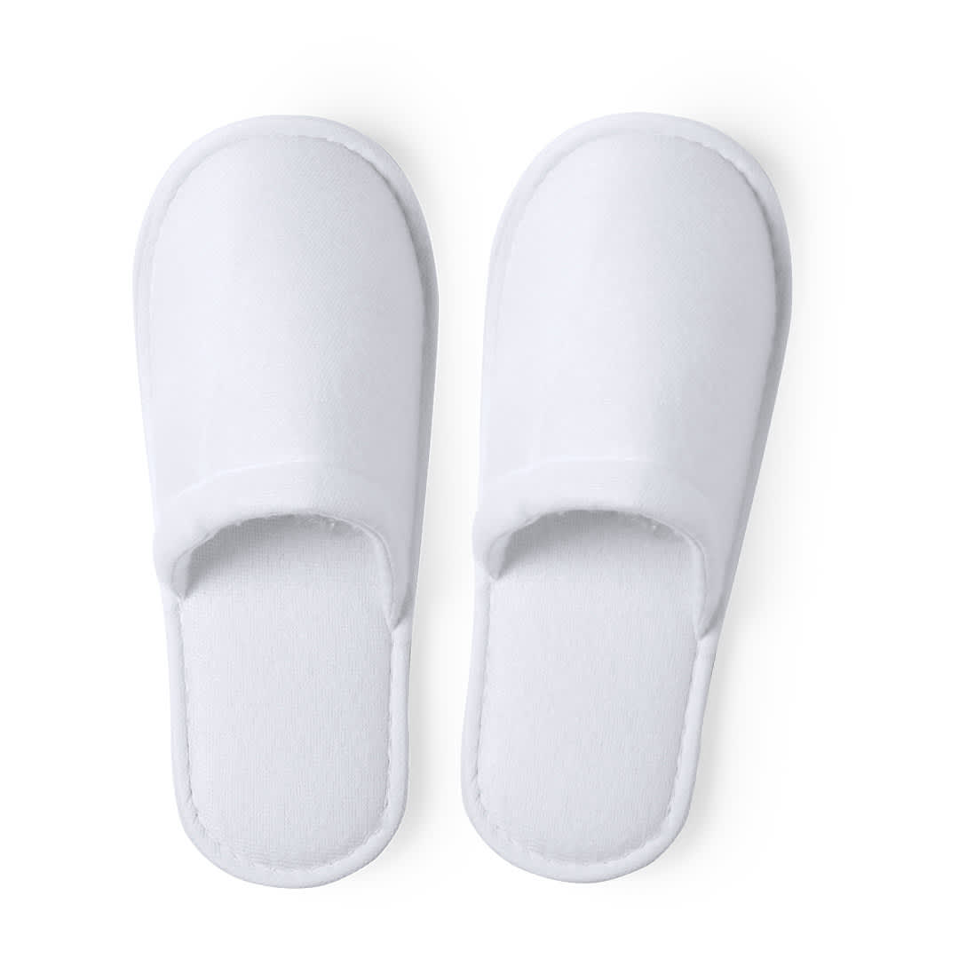 White Tarkun slippers with a simple design and soft texture, featuring an open toe and heel. Tarkun Slippers - Image 1