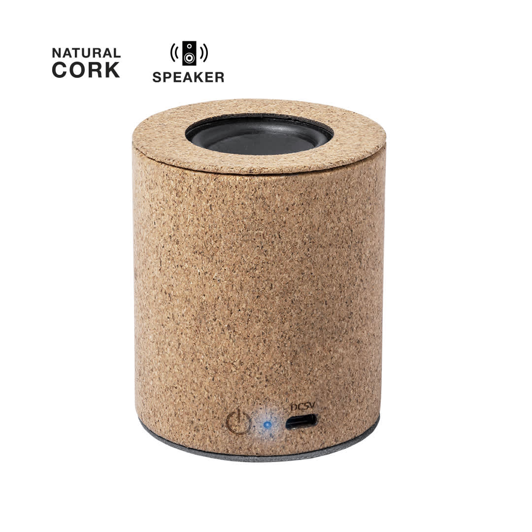A cylindrical speaker made from natural cork, featuring a black speaker grille and a blue indicator light. Yuxter Speaker - Image 1