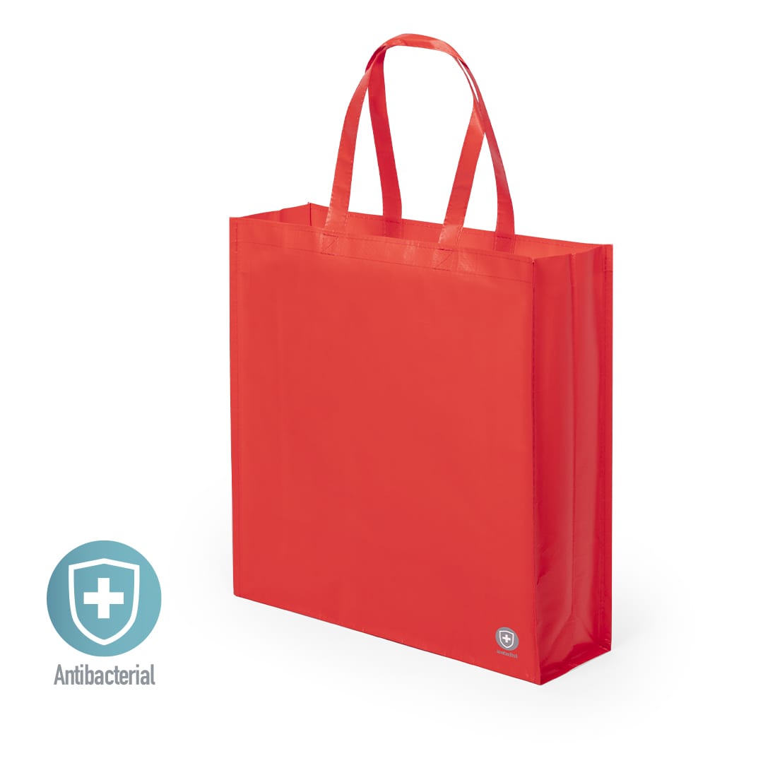 A red reusable grocery bag with handles and an antibacterial feature. It has a logo on one side. Kiarax Antibacterial Bag - Image 1