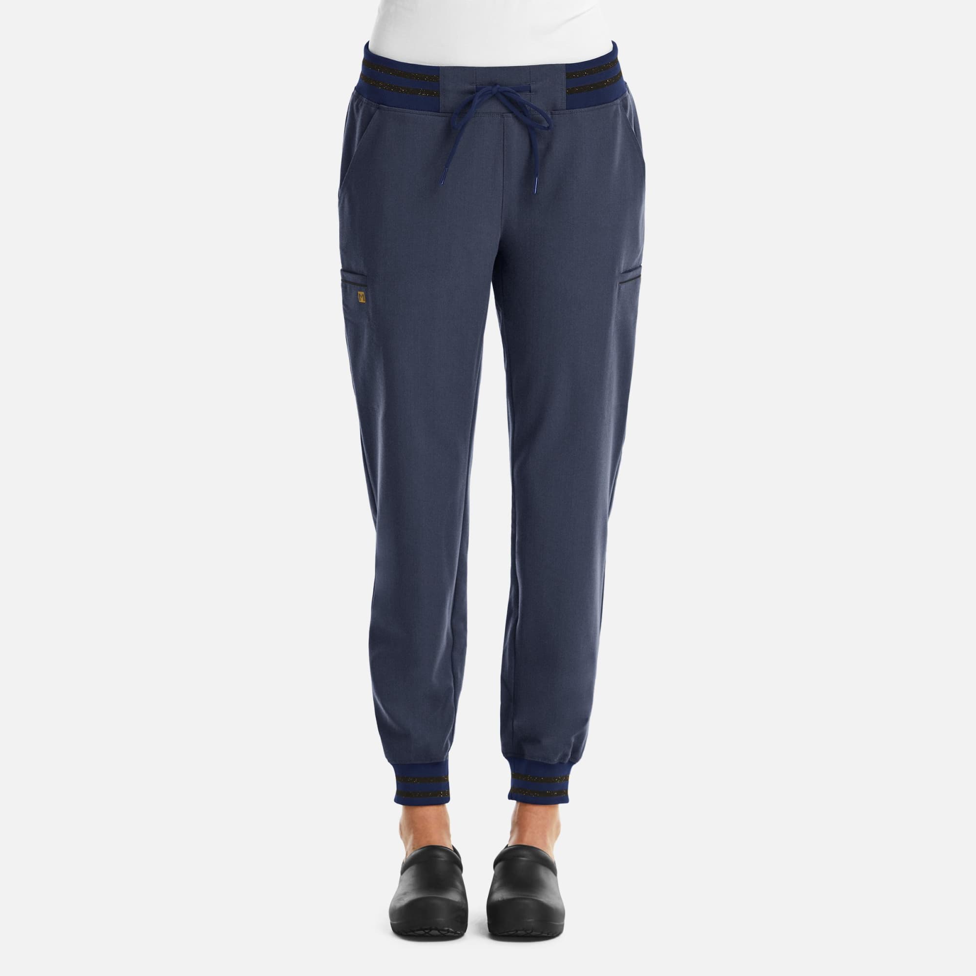 A pair of women's joggers in navy blue with metallic details and a fitted ankle design. Features pockets and a drawstring waist. Matrix Pro Women Full Waist Jogger/Metallic Detail - Image 1