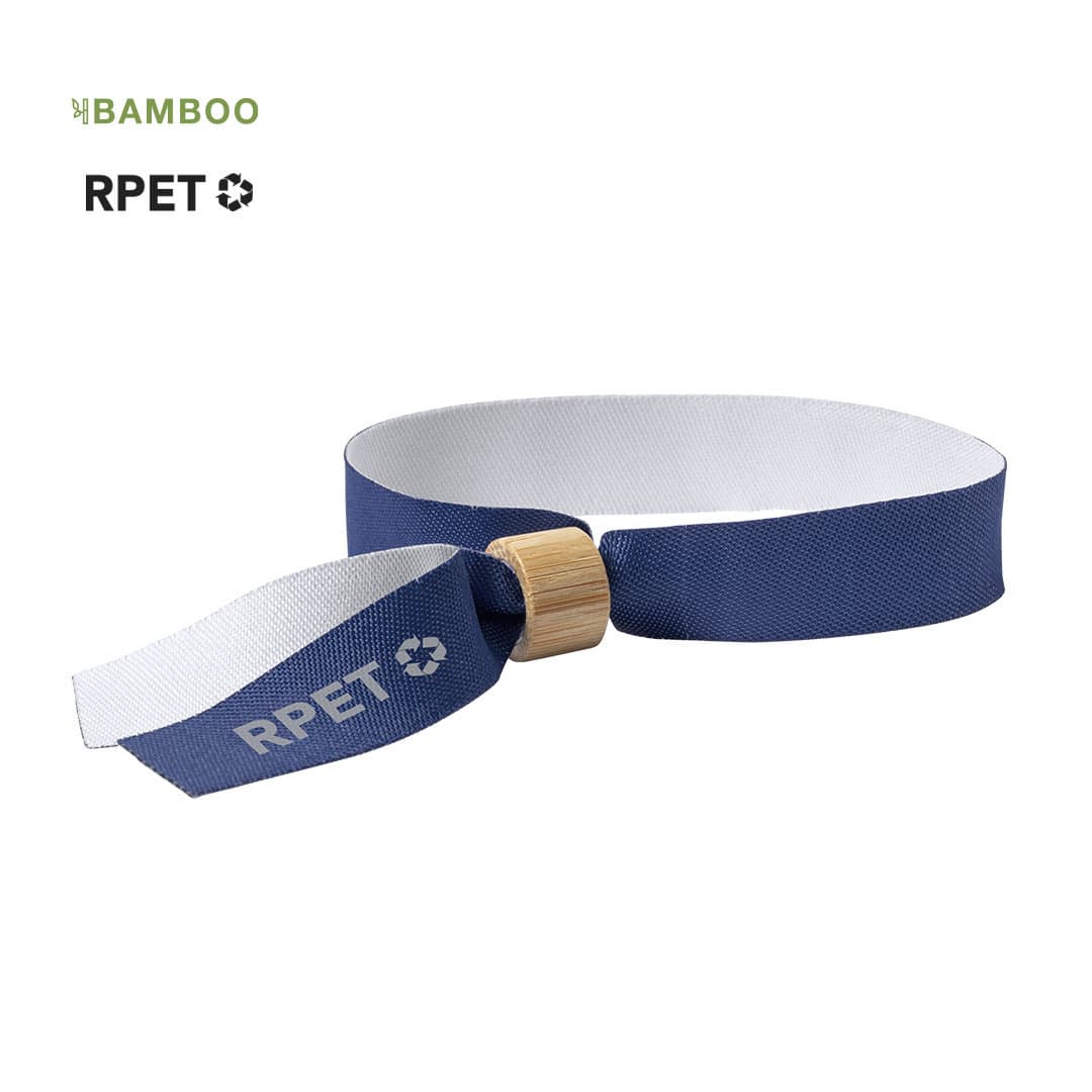A navy blue wristband made from recycled materials, featuring a bamboo clasp and a white section with branding. Broch Bracelet - Image 1
