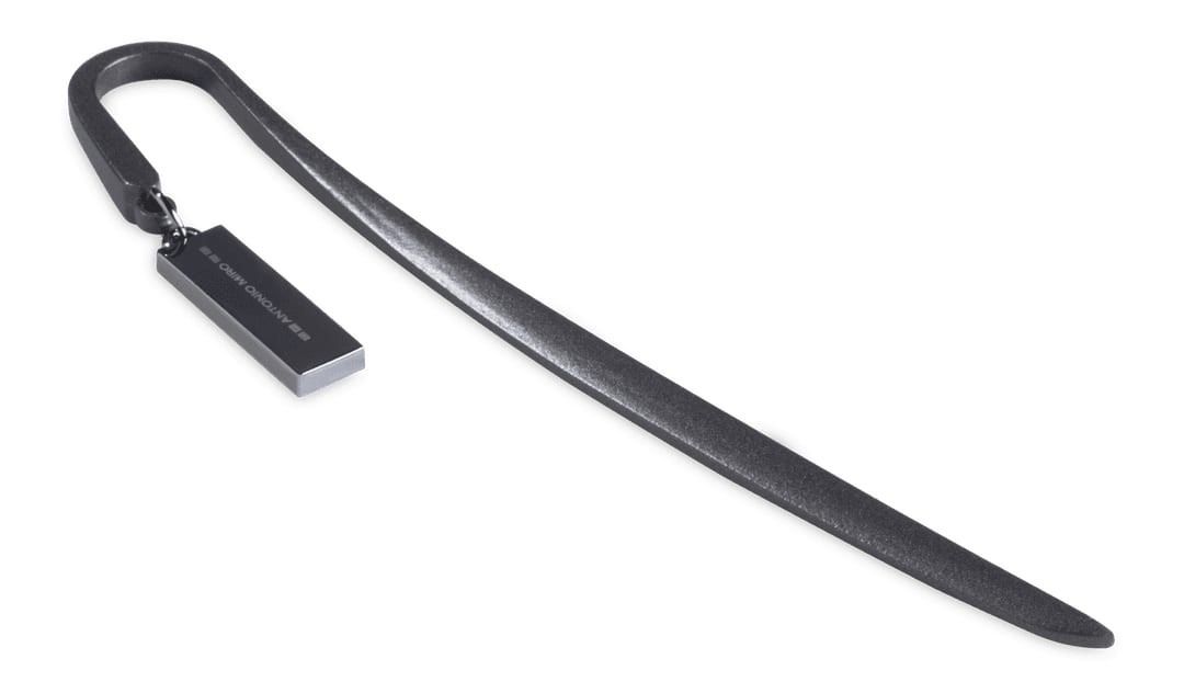 A black bookmark with a curved end and a rectangular tag, featuring a logo or branding. Baloa Bookmark - Image 1