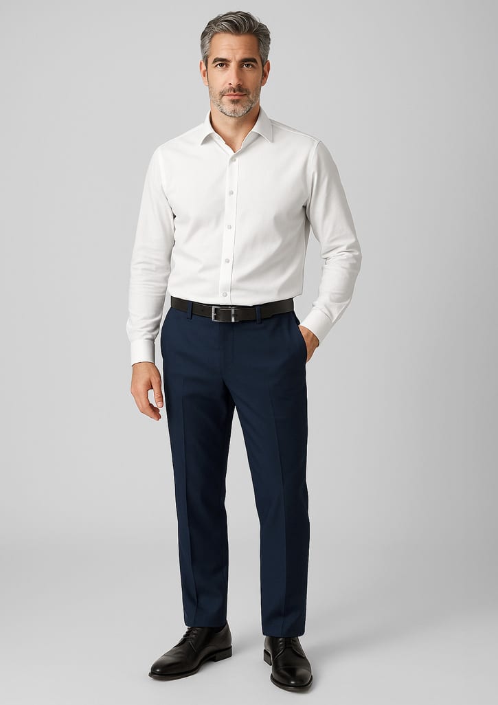 A man wearing a white shirt and navy wool stretch adjustable waist pants, complemented by black shoes. The pants have a logo. Mens Comfort Wool Stretch Adjustable Waist Pant - Image 1