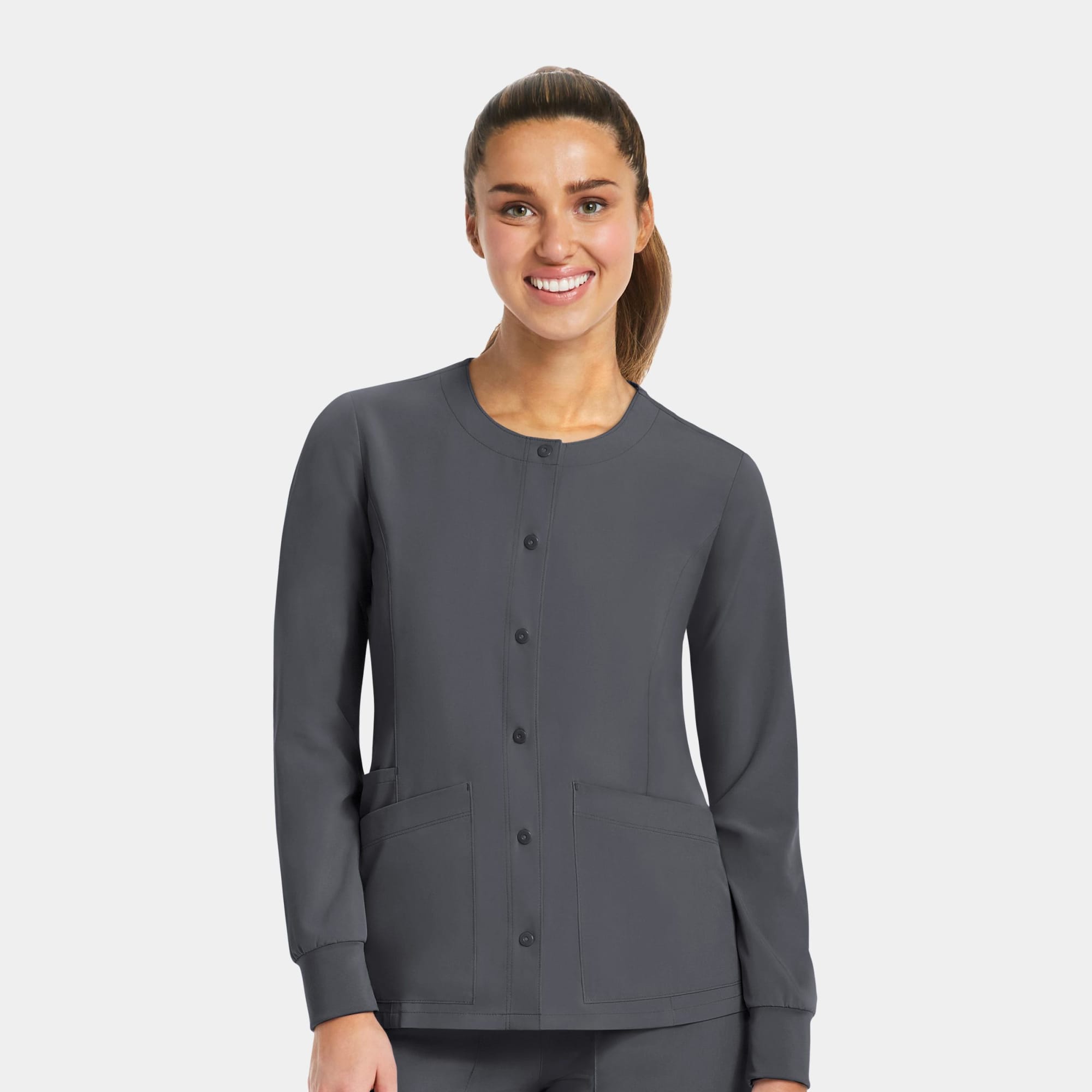 A women's round neck snap jacket in dark grey with long sleeves and two front pockets, featuring a logo. Matrix Impulse Womens Round Neck Snap Jacket - Image 1