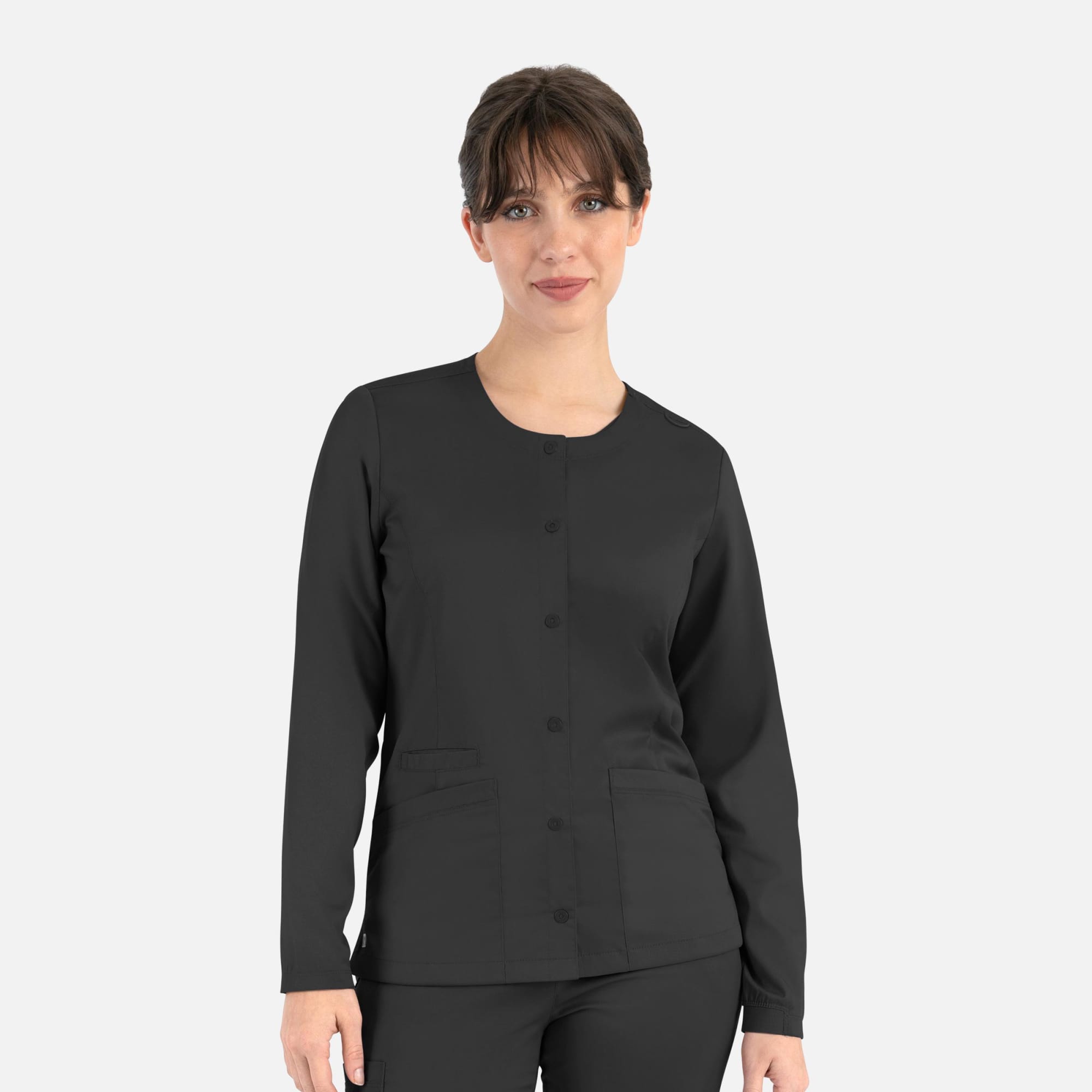 A round neck snap jacket in black, featuring long sleeves and front pockets. It has a logo on it. Matrix Womens Round Neck Snap Jacket - Image 1