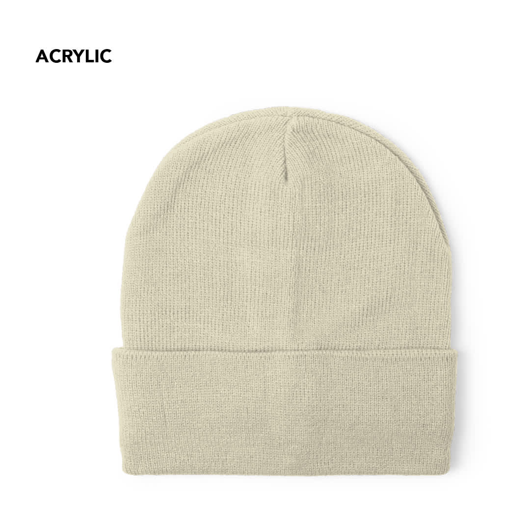 A beige beanie made of acrylic material, featuring a rolled cuff and textured finish. Lana Hat - Image 1